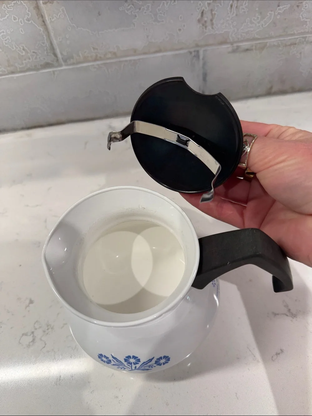 White Ceramic Corningware Teapot with Blue Floral Design and Black Handle